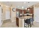 Bright kitchen featuring granite countertops, stainless steel appliances, and a breakfast bar at 11507 84Th Street E Cir # 102, Parrish, FL 34219