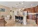 Well-lit kitchen with stainless steel appliances, granite counters, and breakfast bar seating at 11507 84Th Street E Cir # 102, Parrish, FL 34219