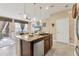 An open kitchen featuring stainless steel appliances and a kitchen island at 11507 84Th Street E Cir # 102, Parrish, FL 34219