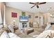 Spacious living room with a sectional sofa, tile flooring, and neutral color palette at 11507 84Th Street E Cir # 102, Parrish, FL 34219
