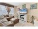 Comfortable living room with a large sectional sofa and a wall-mounted television at 11507 84Th Street E Cir # 102, Parrish, FL 34219