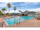 Community pool with a playground, umbrellas and seating for residents, perfect for a day of fun at 11507 84Th Street E Cir # 102, Parrish, FL 34219