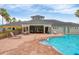 Inviting community pool area with comfortable lounge chairs and shaded seating, perfect for relaxation at 11507 84Th Street E Cir # 102, Parrish, FL 34219