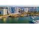 Aerial view of the waterfront community, featuring high-rise condos and a marina at 1155 N Gulfstream Ave # 406, Sarasota, FL 34236