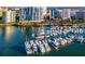 Stunning aerial view of a marina filled with luxurious yachts and waterfront condo buildings at 1155 N Gulfstream Ave # 406, Sarasota, FL 34236