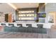 Modern bar area boasts ample seating, stylish decor, recessed lights and a TV for entertainment at 1155 N Gulfstream Ave # 406, Sarasota, FL 34236