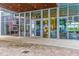 Modern building entrance showcasing glass facade and a view to the interior lobby at 1155 N Gulfstream Ave # 406, Sarasota, FL 34236
