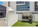 Outdoor dog washing station on artificial turf with built-in tub and shower at 1155 N Gulfstream Ave # 406, Sarasota, FL 34236