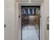Modern stainless steel elevator with sleek interior, illuminated control panel, and accessible handrail at 1155 N Gulfstream Ave # 406, Sarasota, FL 34236