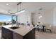 Bright kitchen with a large island, stainless steel appliances, and balcony views at 1155 N Gulfstream Ave # 406, Sarasota, FL 34236