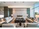 Stylish living area showcasing modern sofas, a fireplace, and elegant decor in neutral tones at 1155 N Gulfstream Ave # 406, Sarasota, FL 34236