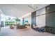 Spacious lobby features modern design with large windows offering serene views of lush tropical landscaping at 1155 N Gulfstream Ave # 406, Sarasota, FL 34236
