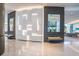 Contemporary lobby with textured wall decor, modern seating, and bright lighting for an inviting entry at 1155 N Gulfstream Ave # 406, Sarasota, FL 34236