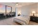 Bedroom with water views, a ceiling fan and a tufted headboard at 1155 N Gulfstream Ave # 406, Sarasota, FL 34236