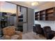 Well-lit office with built-in shelves, modern desk, comfortable seating and a large window with city views at 1155 N Gulfstream Ave # 406, Sarasota, FL 34236