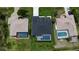 Aerial view of home showing the dark roof, neighboring properties, and lawn at 117 Marker Rd, Rotonda West, FL 33947