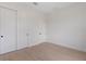 Bedroom with double door closet and light wood flooring at 117 Marker Rd, Rotonda West, FL 33947