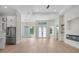 Open living area with hardwood floors, fireplace, and stainless steel appliances at 117 Marker Rd, Rotonda West, FL 33947