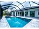 Stunning pool and spa area boasts a screened lanai, perfect for outdoor entertaining at 117 Marker Rd, Rotonda West, FL 33947