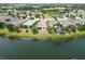 Picturesque aerial shot capturing waterfront homes with verdant lawns and the tranquil community lake at 12183 Longview Lake Cir, Bradenton, FL 34211