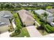 Aerial view capturing a home with a manicured lawn, complemented by lush landscaping and inviting curb appeal at 12183 Longview Lake Cir, Bradenton, FL 34211