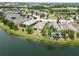 Expansive aerial view of waterfront homes, showcasing lush landscaping and serene lake views in a desirable neighborhood at 12183 Longview Lake Cir, Bradenton, FL 34211