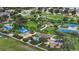 Aerial view showcasing a park with tennis courts, playgrounds, picnic spots, and green spaces for outdoor recreation at 12183 Longview Lake Cir, Bradenton, FL 34211