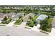 Aerial view showcases well-maintained homes with landscaped yards along a quiet street, creating curb appeal at 12183 Longview Lake Cir, Bradenton, FL 34211