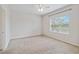 Spacious bedroom with a large window, neutral carpet, and plenty of natural light at 12183 Longview Lake Cir, Bradenton, FL 34211