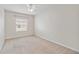 Well-lit bedroom with neutral carpet and a ceiling fan at 12183 Longview Lake Cir, Bradenton, FL 34211