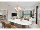Open dining room with a large table and view of the water at 12183 Longview Lake Cir, Bradenton, FL 34211