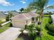 Inviting single-story home with a two-car garage, mature landscaping, and a charming, covered front porch at 12183 Longview Lake Cir, Bradenton, FL 34211