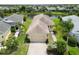 Charming single-story home featuring a well-maintained lawn, mature palm trees, and an attached two-car garage at 12183 Longview Lake Cir, Bradenton, FL 34211