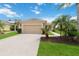 Charming home with a well-manicured lawn and lush landscaping at 12183 Longview Lake Cir, Bradenton, FL 34211