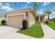 Well-maintained home with lush green lawn and mature landscaping at 12183 Longview Lake Cir, Bradenton, FL 34211