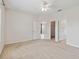 Bright main bedroom with neutral carpet, connecting bathroom, and closet access for easy living at 12183 Longview Lake Cir, Bradenton, FL 34211