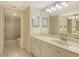 Bright bathroom features neutral colors, large vanity, and walk-in shower at 1226 Siesta Bayside Dr # 1226C, Sarasota, FL 34242