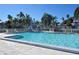 Sparkling community pool surrounded by lush landscaping, offering a refreshing oasis for residents and guests at 1226 Siesta Bayside Dr # 1226C, Sarasota, FL 34242
