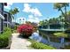 Scenic view of community tennis courts, lake and landscaping at 1226 Siesta Bayside Dr # 1226C, Sarasota, FL 34242