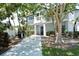 Exterior view of community building with walkway, grill and patio area, offering a relaxing outdoor space at 1226 Siesta Bayside Dr # 1226C, Sarasota, FL 34242