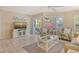 Bright living room with tile floors and a sliding glass door for seamless indoor-outdoor living at 1226 Siesta Bayside Dr # 1226C, Sarasota, FL 34242