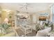 Inviting living room with an open floorplan, tile flooring, and views of the dining area and kitchen at 1226 Siesta Bayside Dr # 1226C, Sarasota, FL 34242