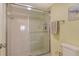 Shower with glass door enclosure, tiled walls, and a handheld shower fixture at 1226 Siesta Bayside Dr # 1226C, Sarasota, FL 34242