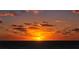 Scenic ocean view at sunset with orange and yellow clouds, a picturesque backdrop for coastal living at 1226 Siesta Bayside Dr # 1226C, Sarasota, FL 34242