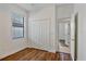 Cozy bedroom with wood floors, closet, and a window at 148 Wandering Wetlands Cir, Bradenton, FL 34212
