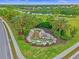 Beautiful entrance to River Strand, featuring landscaping and fountain at 148 Wandering Wetlands Cir, Bradenton, FL 34212