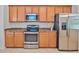 Bright kitchen with stainless steel appliances and granite countertops at 148 Wandering Wetlands Cir, Bradenton, FL 34212