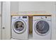Laundry room with modern washer and dryer at 148 Wandering Wetlands Cir, Bradenton, FL 34212