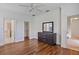Spacious bedroom with hardwood floors and en-suite bathroom at 148 Wandering Wetlands Cir, Bradenton, FL 34212