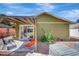 Inviting backyard patio with a shady pergola, sliding glass door access, and room for seating at 1489 18Th St, Sarasota, FL 34234
